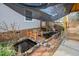 A view of the backyard from the porch, highlighting a pond with a small wooden bridge at 5636 Thom Rd, Mebane, NC 27302