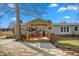 Backyard featuring a covered porch with patio furniture and shed at 5636 Thom Rd, Mebane, NC 27302