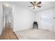 Bedroom features a ceiling fan, carpeted floor, and natural light from the window at 5636 Thom Rd, Mebane, NC 27302