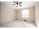 Neutral bedroom with a window and ceiling fan; carpet flooring throughout at 5636 Thom Rd, Mebane, NC 27302