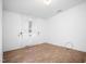 Bright bedroom features hardwood floors, natural light from a window, and neutral paint at 5636 Thom Rd, Mebane, NC 27302