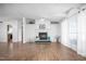 Spacious living room with a fireplace, hardwood floors, and neutral color palette at 5636 Thom Rd, Mebane, NC 27302