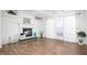 Bright living room with a fireplace, large window, and neutral color palette at 5636 Thom Rd, Mebane, NC 27302