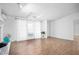 Bright living room with hardwood floors, white walls, and a large window letting in natural light at 5636 Thom Rd, Mebane, NC 27302