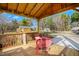 Covered porch featuring outdoor furniture and a view of the sheds in the backyard at 5636 Thom Rd, Mebane, NC 27302