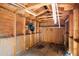 Unfinished shed interior with exposed beams and walls, offering potential for customization at 5636 Thom Rd, Mebane, NC 27302