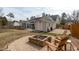 Backyard featuring a fire pit area, shed, and screened-in porch with outdoor seating at 5812 Solitude Way, Durham, NC 27713