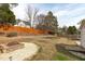 Large backyard featuring a fire pit area, shed, and patio at 5812 Solitude Way, Durham, NC 27713
