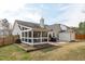 This backyard features a screened in porch, shed, and grill, making it perfect for outdoor entertaining at 5812 Solitude Way, Durham, NC 27713