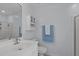 Clean bathroom featuring a white vanity and toilet, next to a shower at 5812 Solitude Way, Durham, NC 27713