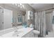 Bathroom showcasing vanity, toilet, and bath with a shower in a coordinated color scheme at 5812 Solitude Way, Durham, NC 27713