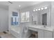 Well-lit bathroom featuring a soaking tub, vanity, and ample counter space at 5812 Solitude Way, Durham, NC 27713