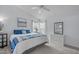 Bright bedroom featuring a ceiling fan, a neutral color palette, and natural light from large windows at 5812 Solitude Way, Durham, NC 27713