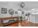 Hallway with hardwood floors leading past a dining room and kitchen at 5812 Solitude Way, Durham, NC 27713