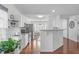 Open-concept kitchen featuring granite countertops, stainless steel appliances, and an adjacent dining area at 5812 Solitude Way, Durham, NC 27713