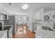 Bright kitchen overlooking the breakfast nook with stainless appliances and light granite countertops at 5812 Solitude Way, Durham, NC 27713