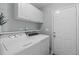 Well-equipped laundry room with a side-by-side washer and dryer at 5812 Solitude Way, Durham, NC 27713