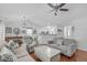 Bright living room with hardwood floors, white walls, and an open-concept design at 5812 Solitude Way, Durham, NC 27713