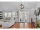 Well-lit living room featuring hardwood floors, and neutral-toned furnishings at 5812 Solitude Way, Durham, NC 27713