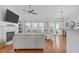Open living room with fireplace, hardwood floors, and abundant natural light at 5812 Solitude Way, Durham, NC 27713