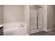 Bathroom features a soaking tub and separate shower, offering a spa-like experience at 59 Peduncle St, Selma, NC 27576