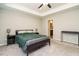 Bedroom with a ceiling fan, neutral walls, and access to an ensuite bathroom for added privacy and convenience at 59 Peduncle St, Selma, NC 27576