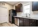 A well-lit kitchen with stainless steel appliances and granite countertops provides a sleek, modern design at 59 Peduncle St, Selma, NC 27576