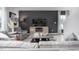 Cozy living room with a large TV, comfortable seating, stylish decor, and a warm ambiance at 6045 Sodium St, Raleigh, NC 27610