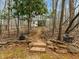 View of outdoor pathway and cottage in the backyard at 6106 Bent Oak Dr, Durham, NC 27705