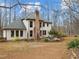 Charming backyard view with a brick patio, lush greenery, and a well-maintained lawn at 6106 Bent Oak Dr, Durham, NC 27705
