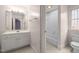 Bright bathroom with white vanity, framed mirror, and bathtub with shower at 6106 Bent Oak Dr, Durham, NC 27705