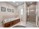 Elegant bathroom boasts a large soaking tub, separate shower, and neutral tones at 6106 Bent Oak Dr, Durham, NC 27705
