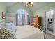 Bedroom with queen bed, vaulted ceiling and an archway window, with a bathroom at 6106 Bent Oak Dr, Durham, NC 27705
