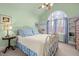 Bedroom with a queen bed, vaulted ceiling, and a arched window at 6106 Bent Oak Dr, Durham, NC 27705