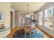 Cozy eat-in kitchen area with glass-top table, wood chairs, and bright natural light at 6106 Bent Oak Dr, Durham, NC 27705