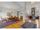 Dining room with hardwood floors, chandelier, and elegant columns at 6106 Bent Oak Dr, Durham, NC 27705