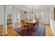 Dining area with a wooden table, ample natural light, and hardwood floors at 6106 Bent Oak Dr, Durham, NC 27705