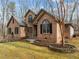 Brick home with a manicured lawn and detailed landscaping at 6106 Bent Oak Dr, Durham, NC 27705