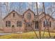 Traditional brick home with beautiful architectural details and manicured landscaping at 6106 Bent Oak Dr, Durham, NC 27705