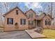 Charming brick home featuring a symmetrical design, arched windows, and a well-maintained front yard at 6106 Bent Oak Dr, Durham, NC 27705