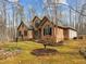 Beautiful brick home surrounded by mature trees and lush landscaping, creating a private and inviting atmosphere at 6106 Bent Oak Dr, Durham, NC 27705