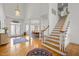 Elegant foyer with hardwood floors, staircase, and view of the dining area at 6106 Bent Oak Dr, Durham, NC 27705
