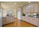 Spacious kitchen features light wood cabinetry, granite counters, and stainless-steel appliances at 6106 Bent Oak Dr, Durham, NC 27705