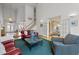 Spacious living room with grand staircase, hardwood floors, bright light, and elegant decor at 6106 Bent Oak Dr, Durham, NC 27705