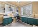 Inviting home office features built-in shelving, a spacious desk, and natural light at 6106 Bent Oak Dr, Durham, NC 27705