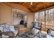 Well-appointed screened porch leading to a storage area, offering both relaxation and utility at 6106 Bent Oak Dr, Durham, NC 27705
