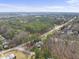 The aerial view highlights the neighborhood's serene environment, lush trees, and quiet residential streets at 6301 King Lawrence Rd, Raleigh, NC 27607
