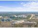 An aerial view displays a property's prime location near modern facilities and green landscapes at 6301 King Lawrence Rd, Raleigh, NC 27607