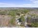 Aerial view showing property surrounded by natural woodlands and neighboring residential properties at 6301 King Lawrence Rd, Raleigh, NC 27607