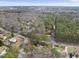 Aerial shot showing the property in a mature neighborhood with abundant trees and well-maintained streets at 6301 King Lawrence Rd, Raleigh, NC 27607